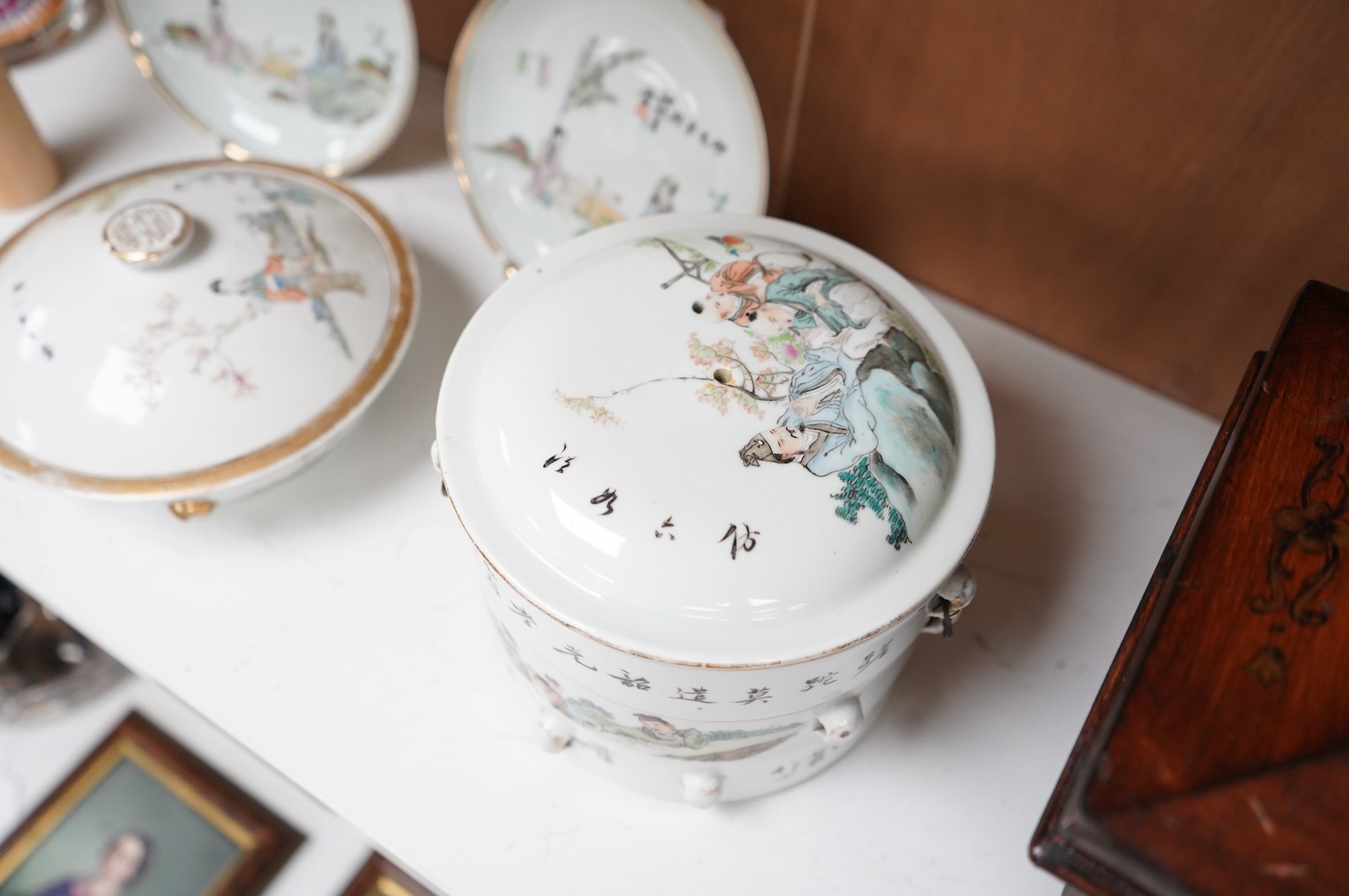 A Chinese Republic period famille rose stacking box, two dishes and a bowl and cover, largest 14cm